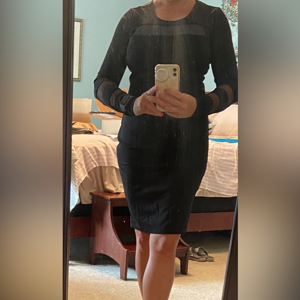 Venus, size 5, body con black dress, short with sheer cut outs on sleeves.